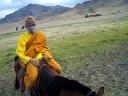 Monk on a horse! He didn't want to get wind on his face...