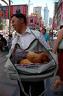 Man selling puppies in the shopping district for 100 yuan