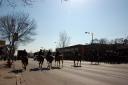 Police on horseback push the crowd off of Western Avenue